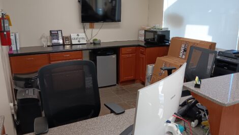 Close up of front desk with computer and boxes at the Towne Storage Saratoga Springs Storage Facility