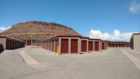 Outdoor red doored storage units at the Towne Storage Washington Dam Storage Facility