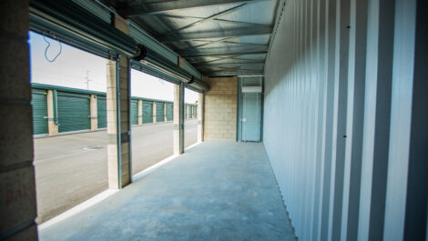 Large exterior storage unit with three doors at the Towne Storage Colt Plaza Storage Facility